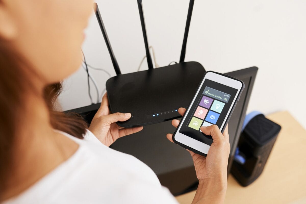 Woman Connecting to Wi-fi Router