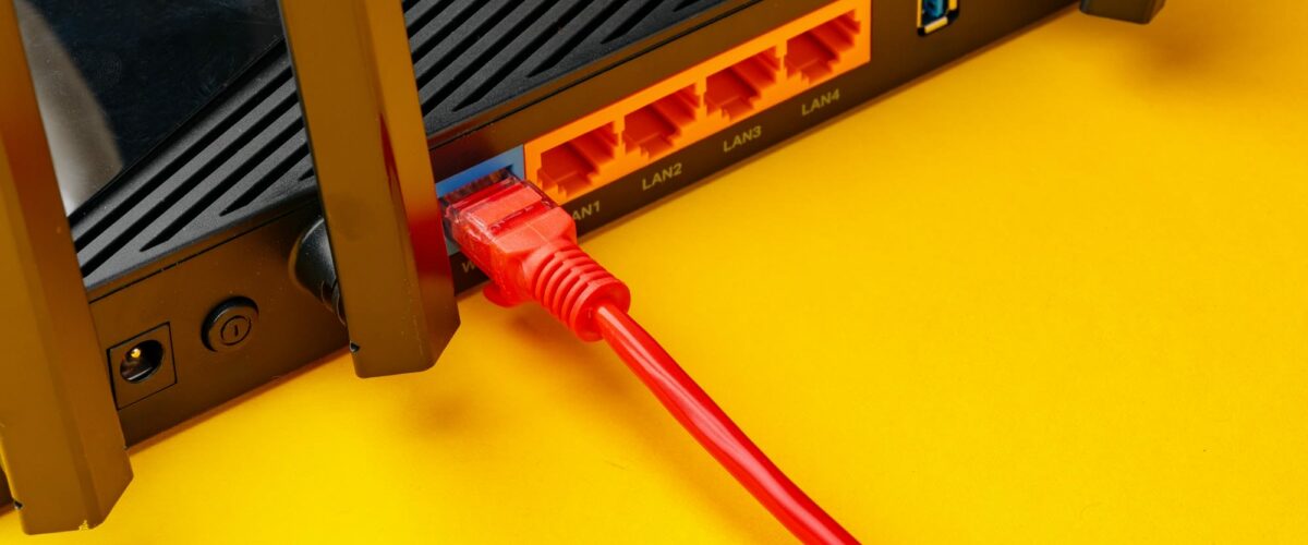 Colored network cable patch-cord on yellow background